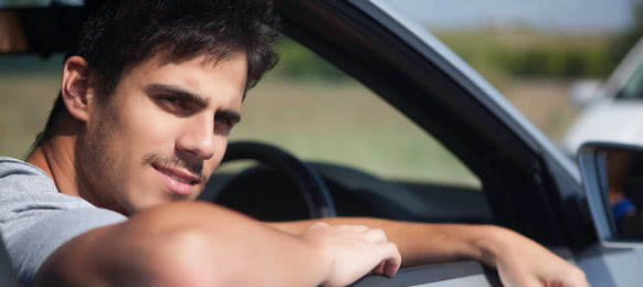 young man waiting in the car